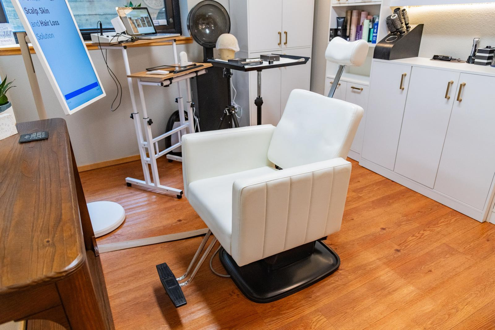 The evaluation chair and scalp analysis screen at Core & Crown Collective in Fort Collins